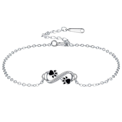 Pulsera con colgante de pata de mascota y símbolo de infinito con circonita cúbica