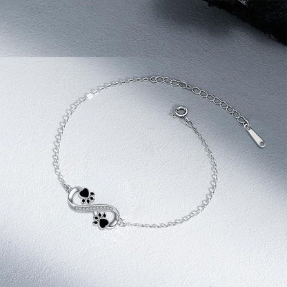 Pulsera con colgante de pata de mascota y símbolo de infinito con circonita cúbica
